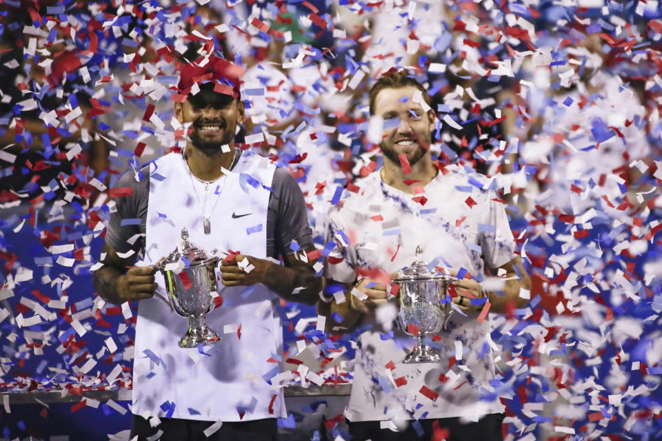 Nick Kyrgios and Jack Sock, pictured here after winning the doubles title in Washington.