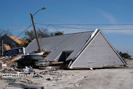 A roof of a house that has been blown into the middle of the street is pictured following Hurricane Michael in Mexico Beach, Florida, U.S., October 11, 2018. REUTERS/Carlo Allegri