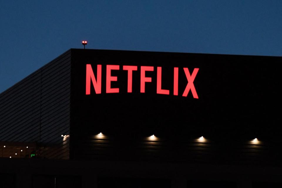 The Netflix logo is seen on the Netflix, Inc. building on Sunset Boulevard in Los Angeles, California on October 19, 2021. - Netflix reported billion-dollar profits and booming subscriber growth on October 19 that beat forecasts as global hits like Squid Game drew viewers in droves. (Photo by Robyn Beck / AFP) (Photo by ROBYN BECK/AFP via Getty Images)