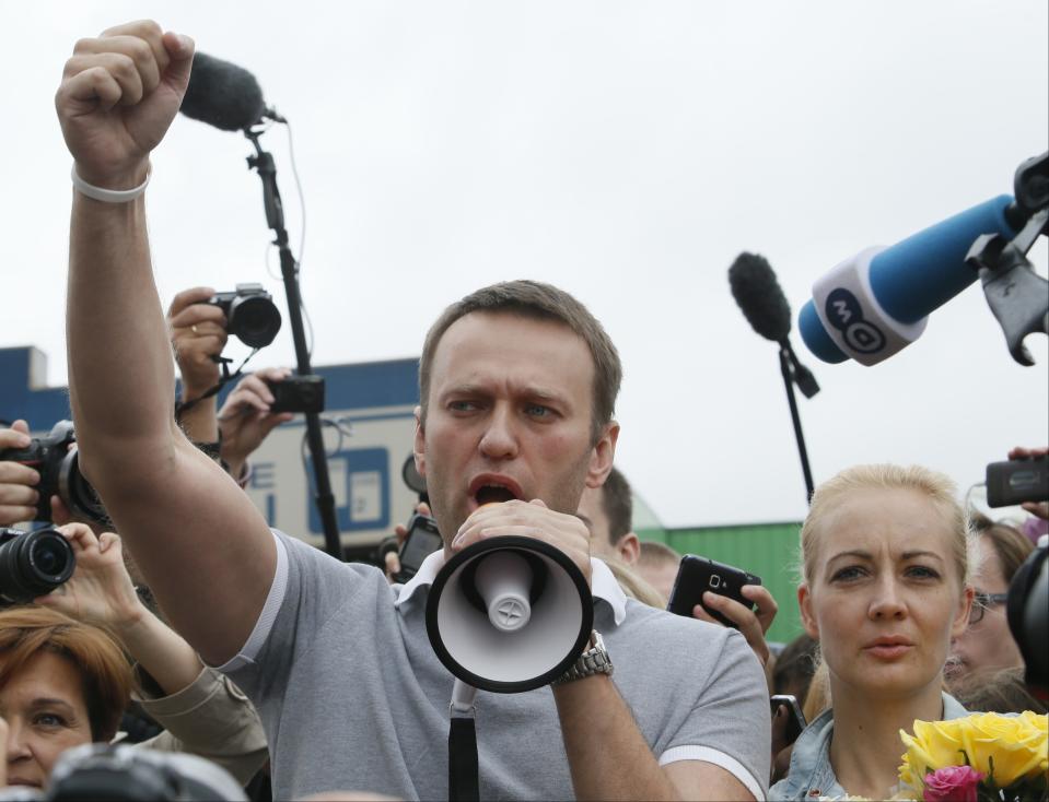 Alexei Navalny with his wife Yulia Navalnaya leads a protest in Moscow in 2013.