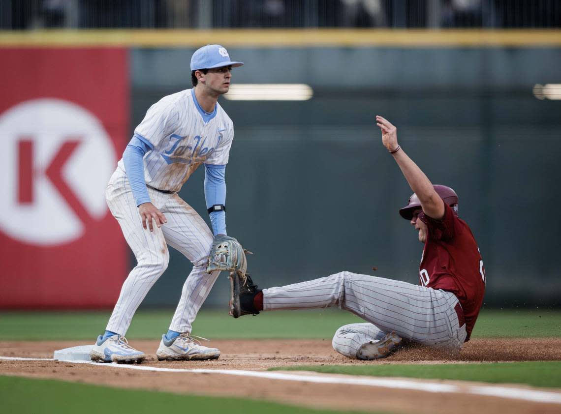 Gamecock outfield Ethan Petry (20) is safe at 3rd. North Carolina and South Carolina would play at Truist Field on April 9, 2024.