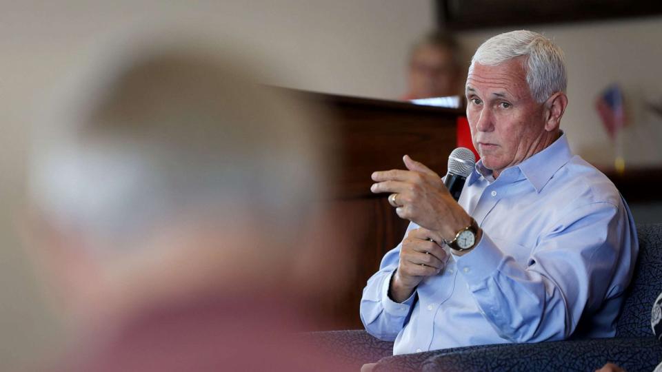 PHOTO: Former Vice president Mike Pence speaks with guests during a campaign stop he made with his wife Karen, July 6, 2023, in Holstein, Iowa. (Scott Olson/Getty Images)