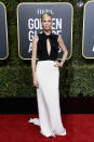 <p>Theron opted for a classic black and white Dior dress for the red carpet. Image via Getty Images. </p>