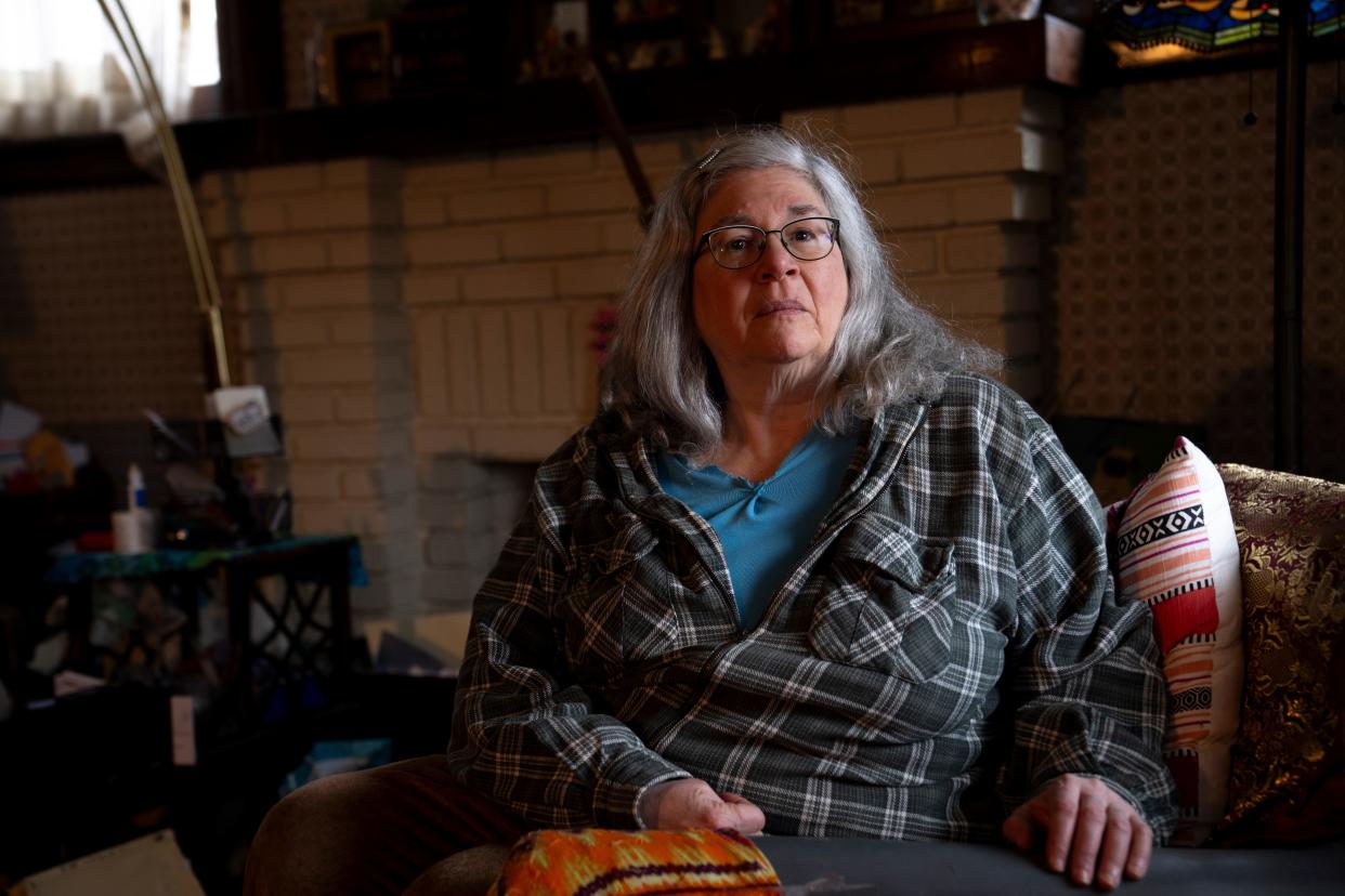 Sheryl Pockrose sits in her home in West Price Hill on Tuesday, Jan. 30, 2024. She said she hasn't done anything to her house to warrant the increased in her property value from $47,000 to $97,000, which resulted in a more than 80% increase in her property taxes.