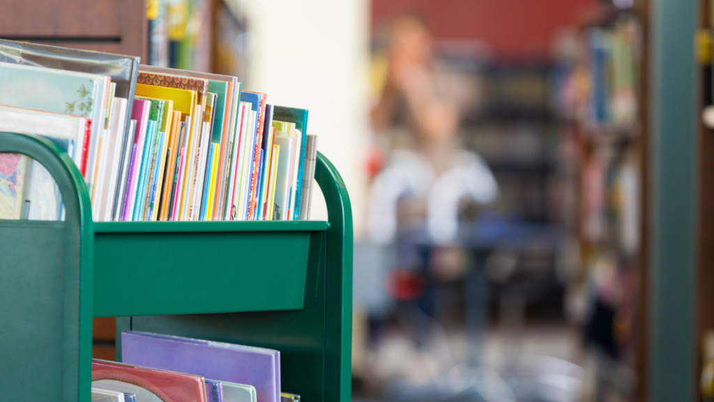 A cart of children's books in a library