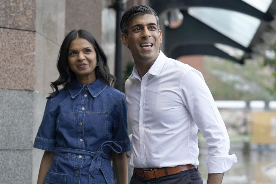 British Prime Minister Rishi Sunak and wife Akshata Murty arrive on the eve of the Conservative Party Conference, in Manchester, England, Saturday, Sept. 30, 2023. Britain's governing Conservative Party is gathering for its annual conference on Sunday. (Stefan Rousseau/PA via AP)