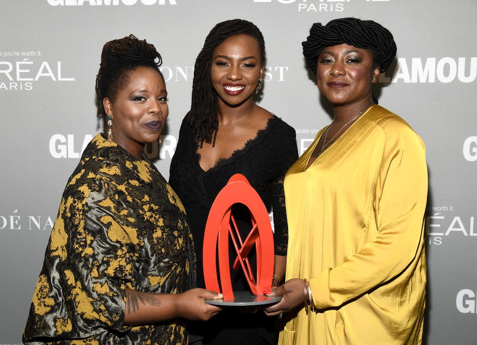 Honorees Patrisse Khan-Cullors, Opal Tometi, and Alicia Garza pose with an award during Glamour Women of the Year 2016 at NeueHouse Hollywood in 2016. (Photo: Frazer Harrison/Getty Images for Glamour)