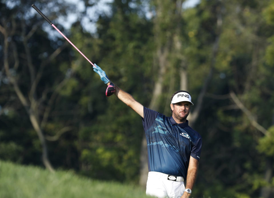 Bubba Watson points in the direction of his tee shot on the 12th hole during the second round of the PGA Championship golf tournament at Bellerive Country Club, Friday, Aug. 10, 2018, in St. Louis. (AP Photo/Brynn Anderson)