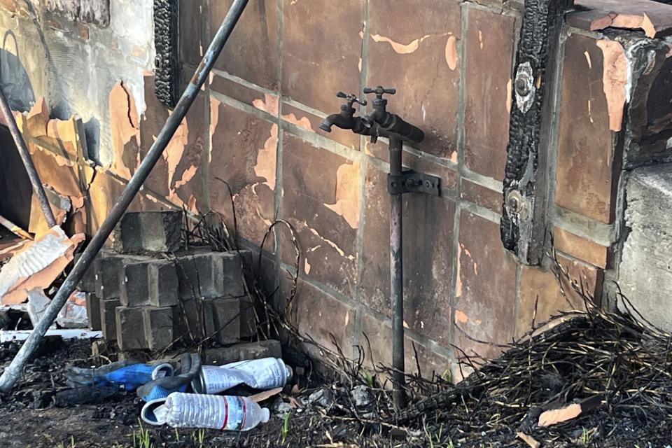 A damaged home has an exposed water spigot in Kula, Hawaii on Aug. 25, 2023. Residents of Maui are eager to learn when they can expect safe drinking water to be restored in the wake of last month’s catastrophic wildfires, but extensive testing is still needed and officials are urging patience. (Andrew Whelton/Purdue University via AP)