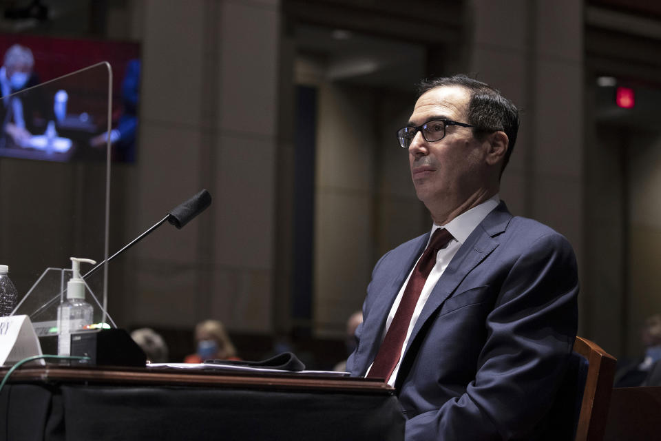 FILE - In this June 30, 2020 file photo, Treasury Secretary Steven Mnuchin testifies during a House Financial Services Committee hearing on the coronavirus response on Capitol Hill in Washington. The Treasury Department said it is releasing on Monday, July 6 the names of more than 700,000 companies that received funds from the government’s small business lending program, a massive effort intended to support the economy as states shut down in April to contain the viral outbreak (Tasos Katopodis/Pool via AP, File)