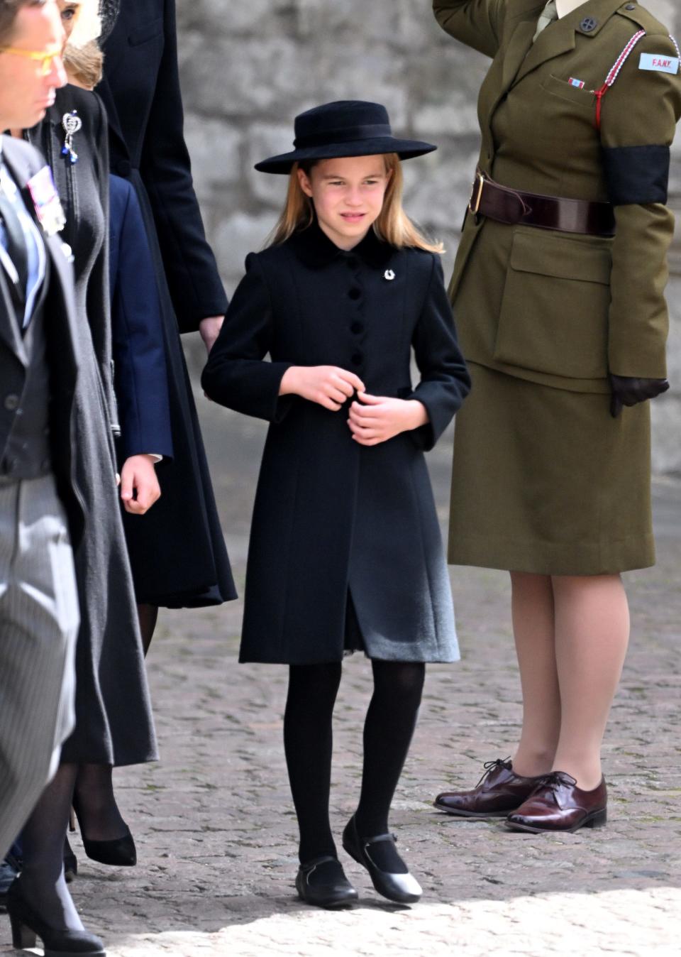 Princess Charlotte of Wales stands outside Westminster Abbey on September 19, 2022, the day of Queen Elizabeth II's funeral.