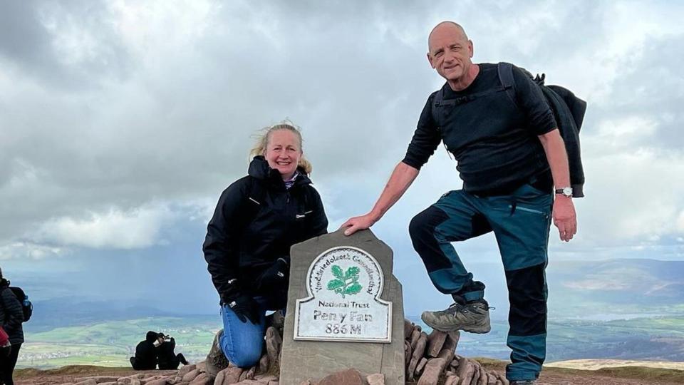 Steve Fletcher and his partner Mel on Pen y Fan