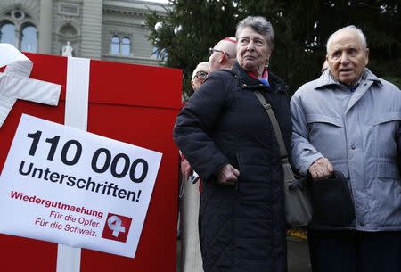 So called contract children, now adults, attend the initiative of seeking a restituition package in Bern December 19, 2014. REUTERS/Ruben Sprich