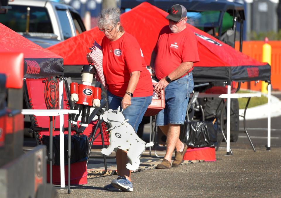 Nancy and Scott Wall from Hawkinsville, Ga., decorate their RV spot last year. The Bulldog fans have been setting up camp in RV city for the last 13 years and have been attending the Florida/Georgia games since the late 1980's.
