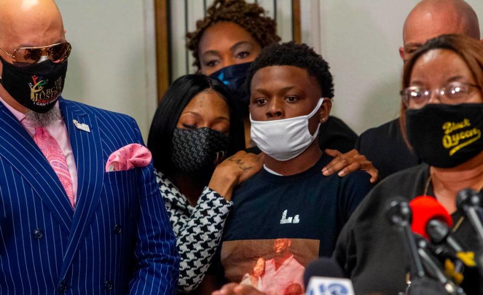 Andrew Brown Jr.’s longtime partner Patrice Revelle comforts their son Jhamiere Revelle, 14, during a press conference Saturday, April 24, 2021 demanding the release of body camera footage in the shooting death of Brown by a Pasquotank County Sheriff Deputy in Elizabeth City on Wednesday.