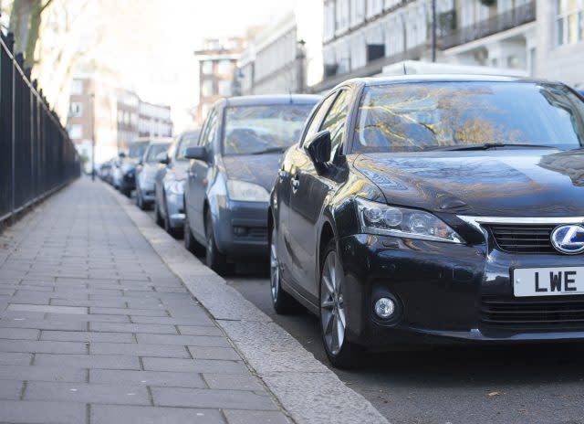 Cars parked on a residential street in London. (Lauren Hurley/PA)