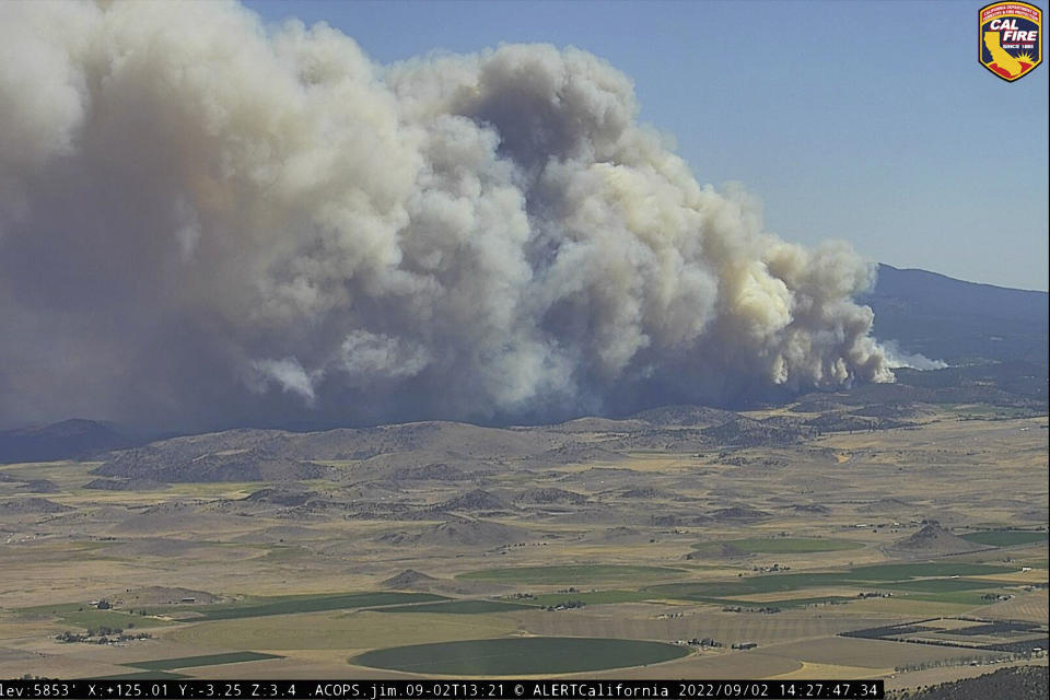 In this image from a Cal Fire monitoring camera on Antelope Mountain, the Mill Fire burns near Weed, Calif., Friday Sept. 2, 2022. (Cal Fire/ALERTWildfire Network via AP)