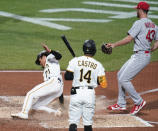 Pittsburgh Pirates' Ji Hwan Bae (71) scores next to Rodolfo Castro (14) on a wild pitch by St. Louis Cardinals' Dakota Hudson (43) during the third inning of a baseball game Tuesday, Oct. 4, 2022, in Pittsburgh. (AP Photo/Keith Srakocic)