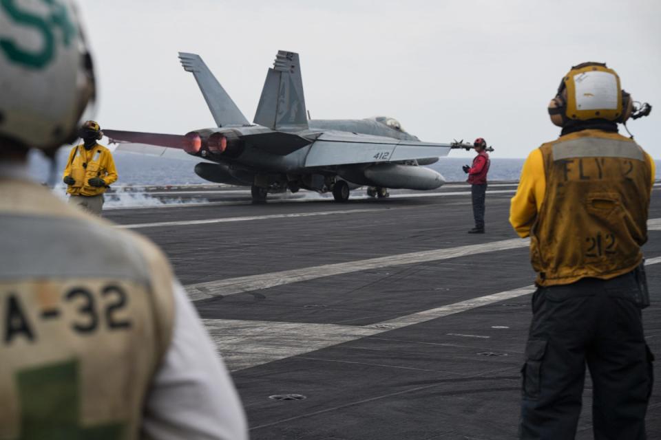 An F/A-18E Super Hornet, attached to the "Gunslingers" of Strike Fighter Squadron (VFA) 105, launches from the flight deck of the Eisenhower in the Red Sea on April 9