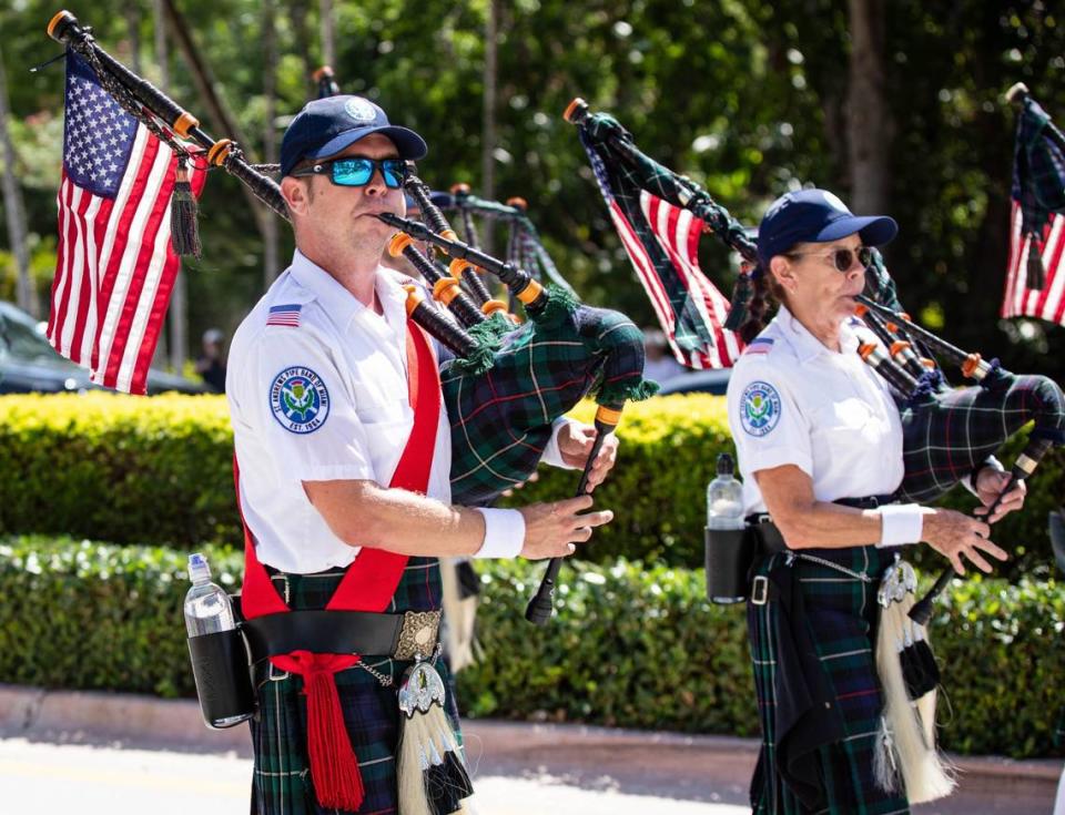 A member of the Saint Andrews Pipe Band of Miami plays the bagpipes while marching in the Independence Day parade on Thursday, July 4, 2024 in Key Biscayne, Fla. The Key Biscayne 4th of July parade is one of the oldest parades in South Florida, celebrating its 65th year.