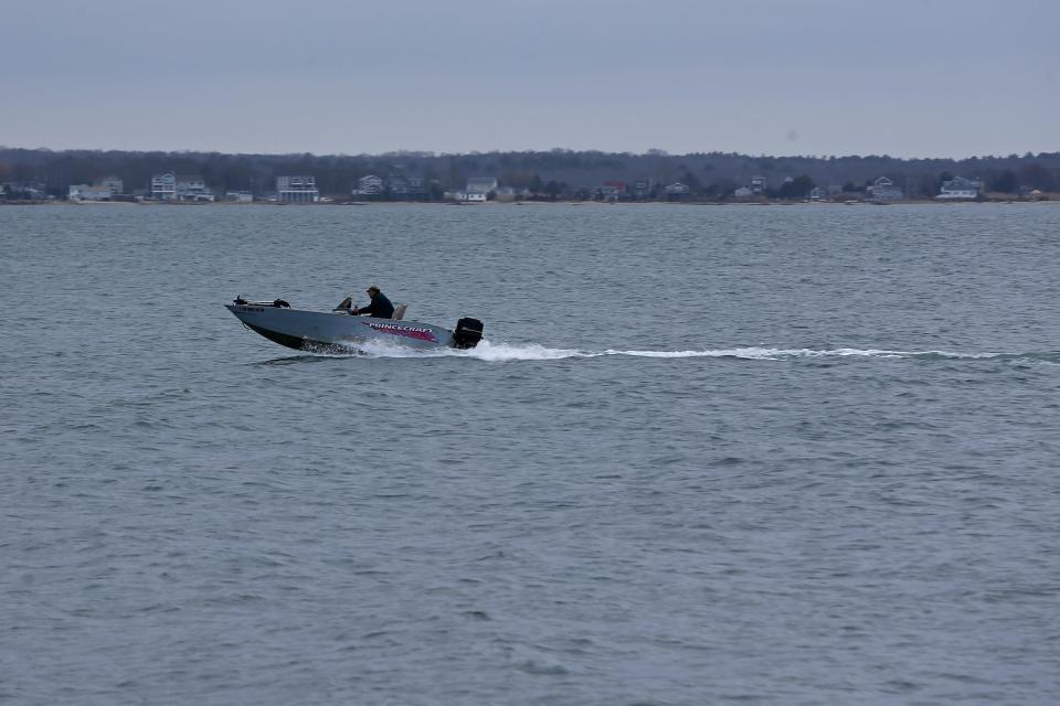 A man speeds his way across Buzzards Bay on his way towards New Bedford harbor.