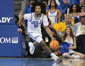 UCLA guard Tyger Campbell brings the ball up the floor while playing Oregon during the second half in an NCAA college basketball game, Sunday, Dec. 4, 2022, in Los Angeles. UCLA won 65 to 56. (AP Photo/John McCoy)