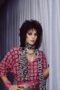 <p> The frontwoman of the Runaways and Joan Jett & the Blackhearts knew the power of black eyeliner. She also knew how to mix textures too. I mean, an animal print scarf with a pink geometrical shirt? Genius. </p>