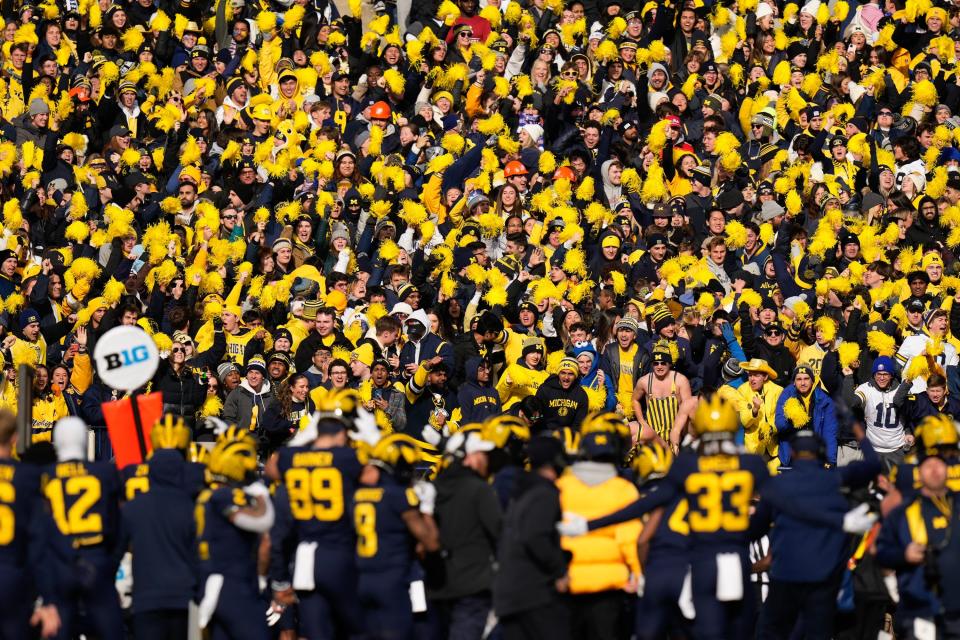 Michigan fans cheer during the 2023 win over Ohio State at Michigan Stadium, which is also known as "The Big House." Michigan claims a streak of 315 straight games with a crowd of more than 100,000. That surely will grow to 316 for Saturday's showdown with No. 4 Texas.