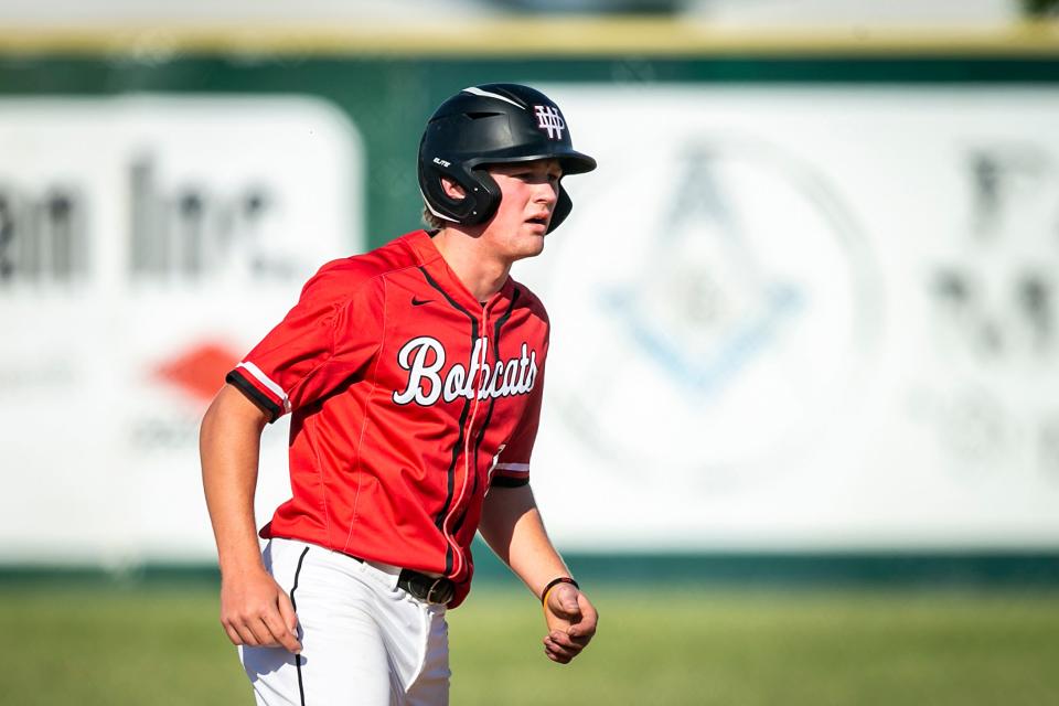 Western Dubuque's Brett Harris leads off second base during a high school baseball game against Cedar Rapids Kennedy on May 30 in Farley.