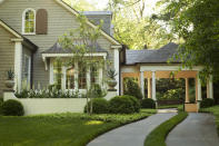 <p> For an unexpected take on typical front yard landscaping ideas, get a little strategic about your grassy areas. </p> <p> 'The classic detail of a grass strip down the driveway guides the eye through the porte cochere and creates a sense of anticipation, thereby encouraging movement through the entirety of the exterior space,' explains Carson McElheney, a landscape and design architect in Atlanta.  </p> <p> Carson explains that this driveway or front walkway will add visual interest and functionally while maximizing even the smallest of spaces. </p>