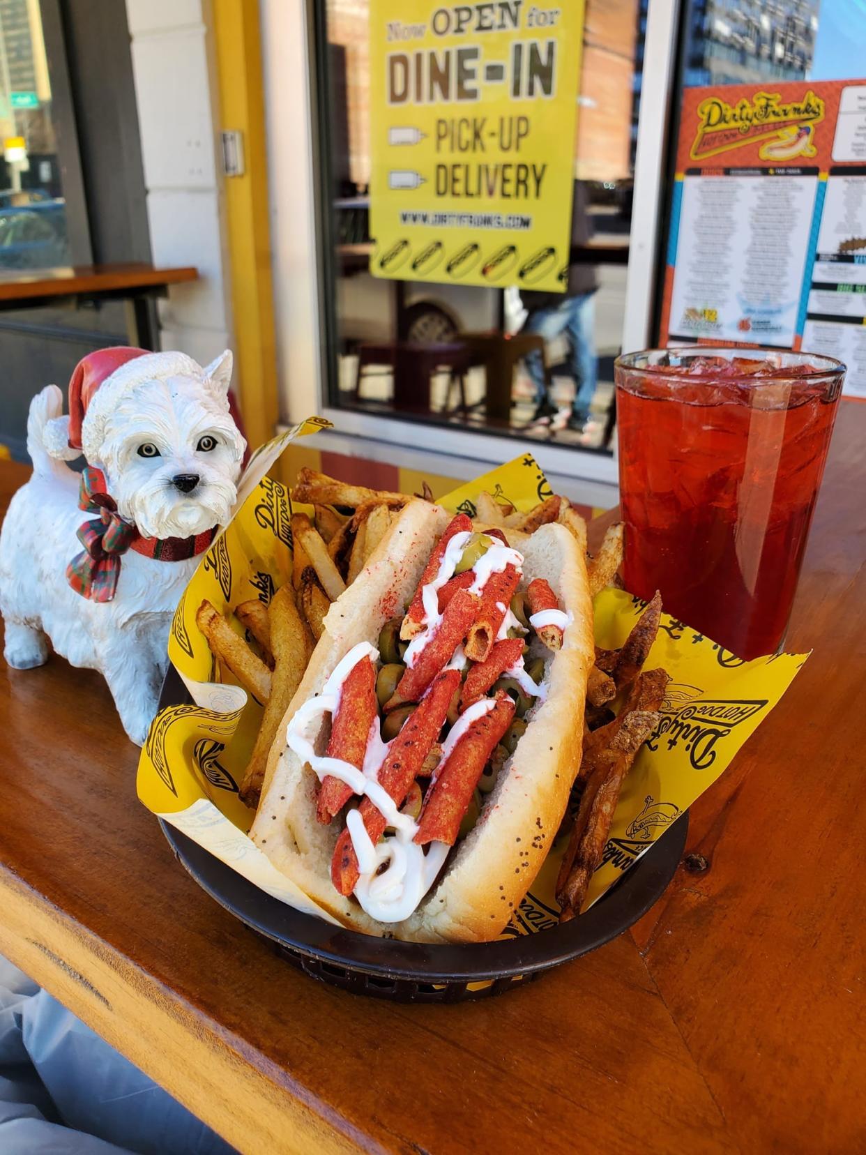 Dirty Frank's Feliz Navidog has the colors of Christmas with red and green peppers and Takis tortilla chips.