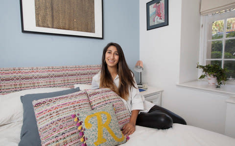 Radhika Sanghani on her bed which she upholstered herself  - Credit: Rii Schroer