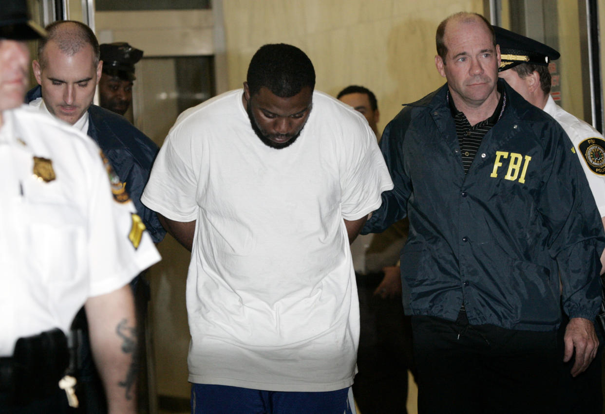 Onta Williams is walked out of the FBI offices after being taken into custody in New York May 21, 2009. (Reuters)