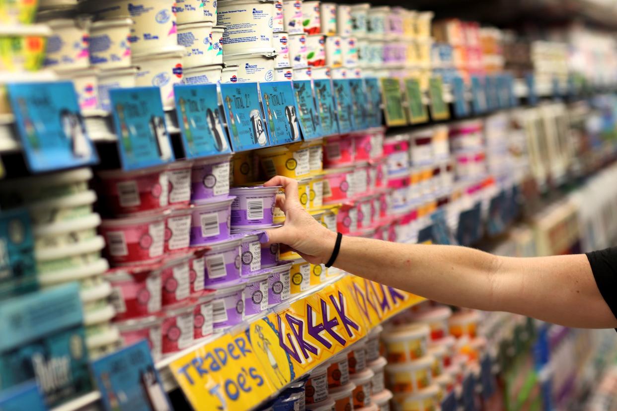 Dawn Moreno shops for yogurt as she enjoys the grand opening of a Trader Joe's on October 18, 2013 in Pinecrest, Florida.