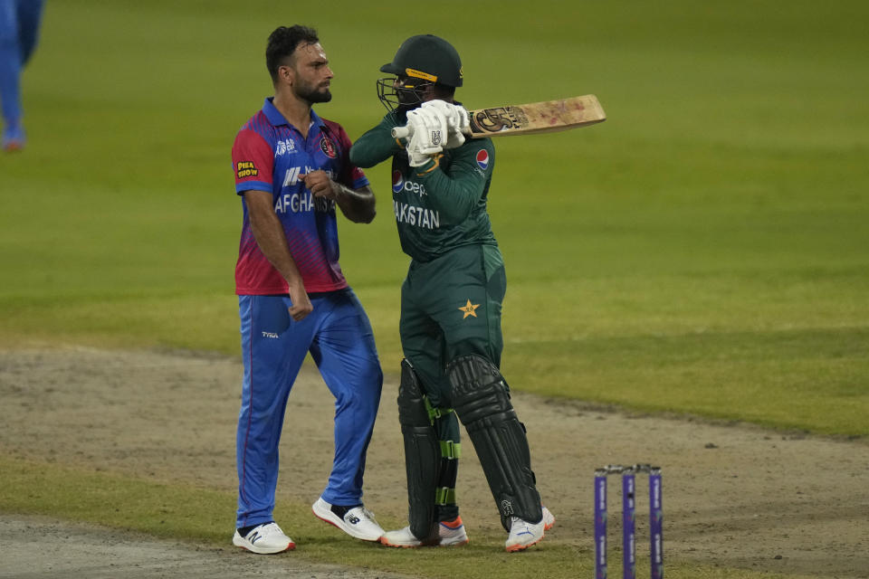 Afghanistan's Fareed Ahmad, left, and Pakistan's Asif Ali, right, react after Ali was dismissed by Ahmad during the T20 cricket match of Asia Cup between Pakistan and Afghanistan, in Sharjah, United Arab Emirates, Wednesday, Sept. 7, 2022. (AP Photo/Anjum Naveed)