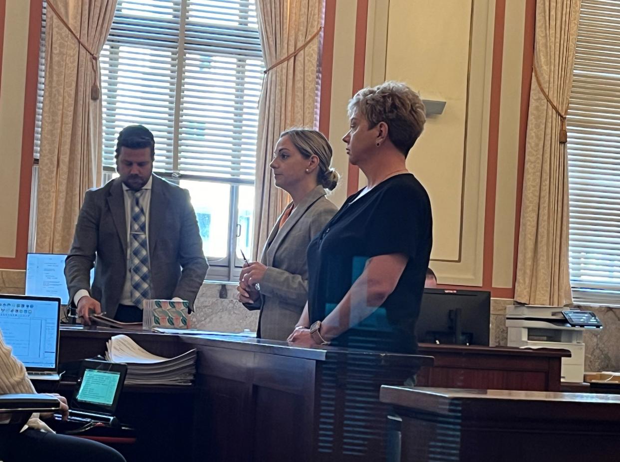 Kimberly Clark, at right, stands next to her attorney, Chelsea Panzeca, during her sentencing in Hamilton County Common Pleas Court on Wednesday.