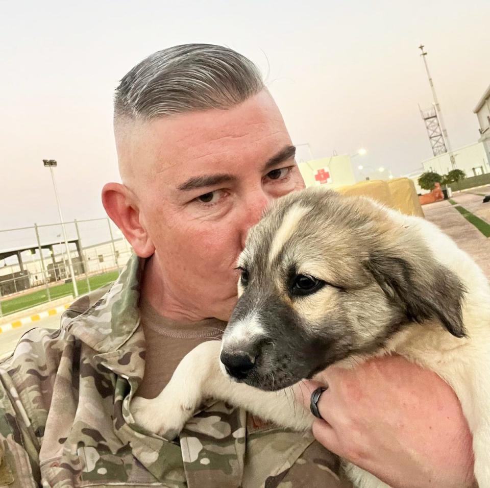 Air Force Senior Master Sgt. Chris Grimes is pictured in Jordan with Tucker the puppy in October 2022. Grimes had to say goodbye to his new buddy without knowing whether he would ever see him again.
