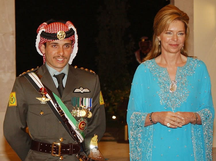 ** FILE ** Jordan's Crown Prince Hamzeh, left, with his mother Queen Noor, right, during his wedding ceremony in Amman, Jordan, in this May 27, 2004, file photo. Jordan's King Abdullah II stripped his half-brother and heir apparent of his title as crown prince Sunday Nov. 28, 2004, in another major succession switch in the Hashemite dynasty that rules Jordan. King Abdullah II had named Hamzah crown prince hours after their father King Hussein died of cancer on Feb. 7, 1999.(AP Photo/Hussein Malla)