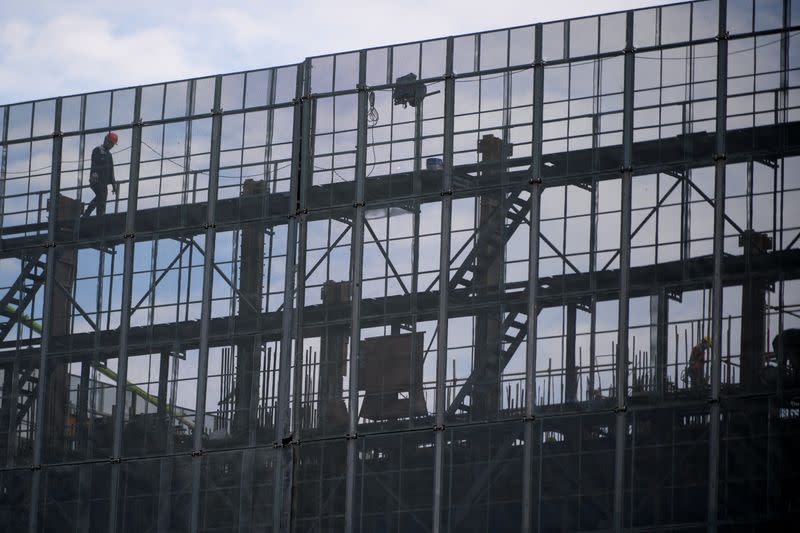 Workers work at a construction site, following the coronavirus disease (COVID-19) outbreak, in Shanghai