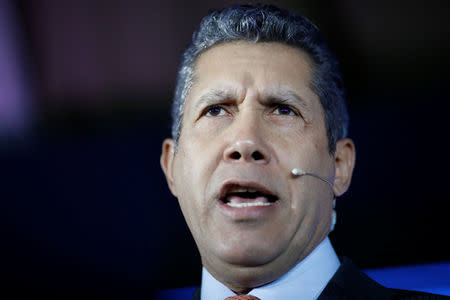 Venezuelan presidential candidate Henri Falcon of the "Avanzada Progresista" party speaks during the presentation of his government plan at a meeting with supporters in Caracas, Venezuela April 23, 2018. REUTERS/Carlos Garcia Rawlins