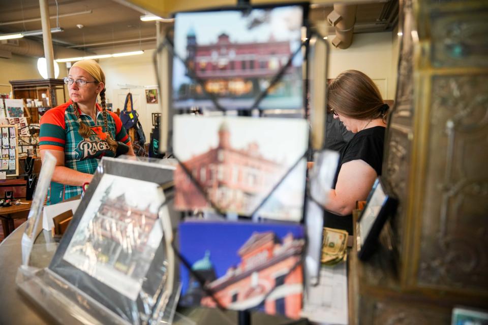 Jen Weese of Lancaster, Pennsylvania, makes a purchase from Ed and Eva's as riders stop in Greenfield for RAGBRAI 2024 on Tuesday, July 23, 2024.