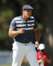 Bryson DeChambeau pumps his fist after a birdie putt on the 10th green during the final round of the Rocket Mortgage Classic golf tournament, Sunday, July 5, 2020, at Detroit Golf Club in Detroit. (AP Photo/Carlos Osorio)