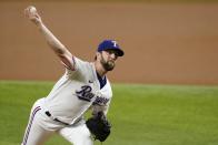 Texas Rangers starting pitcher Jordan Lyles throws to a Los Angeles Angels batter during the first inning of a baseball game in Arlington, Texas, Tuesday, Aug. 3, 2021. (AP Photo/Tony Gutierrez)