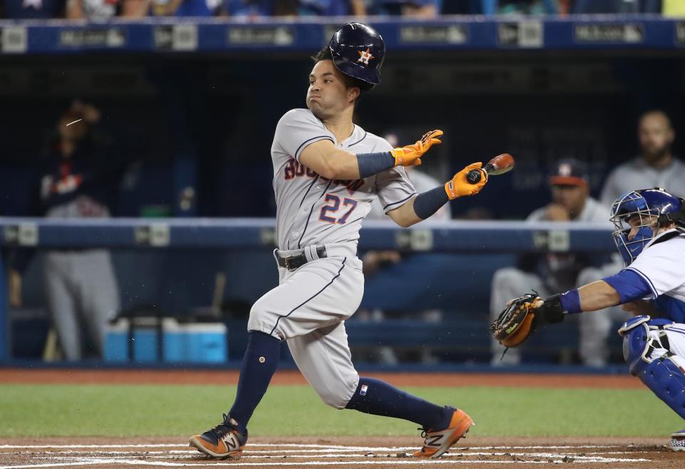 Jose Altuve #27 of the Houston Astros hits a broken-bat single in the first inning during MLB game action against the Toronto Blue Jays at Rogers Centre on July 7, 2017 in Toronto, Canada