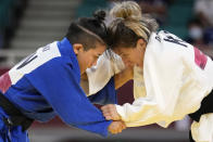 Funa Tonaki of Japan, left, and Distria Krasniqi of Kosovo compete during their women's -48kg championship judo match at the 2020 Summer Olympics, Saturday, July 24, 2021, in Tokyo, Japan. (AP Photo/Vincent Thian)