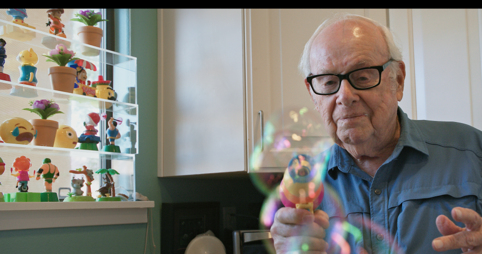 Goldfarb plays with one of his most well-known inventions, the original Bubble Gun, which shoots out bubbles from a gun-shaped device. It's since inspired hundreds of iterations in many forms and shapes.