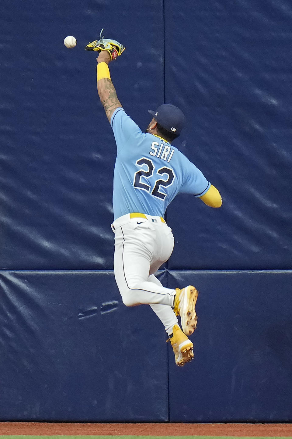 Tampa Bay Rays center fielder Jose Siri (22) can't hang onto a double by Los Angeles Dodgers' Freddie Freeman during the third inning of a baseball game Sunday, May 28, 2023, in St. Petersburg, Fla. (AP Photo/Chris O'Meara)