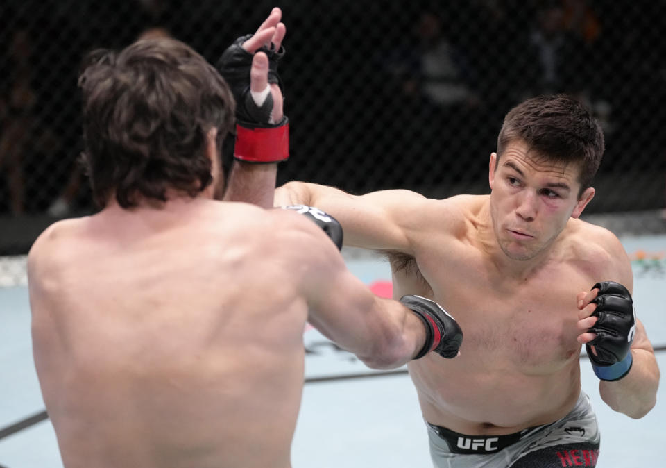 LAS VEGAS, NEVADA – FEBRUARY 18: (R-L) Alexander Hernandez punches Jim Miller in a lightweight fight during the UFC Fight Night event at UFC APEX on February 18, 2023 in Las Vegas, Nevada. (Photo by Jeff Bottari/Zuffa LLC via Getty Images)