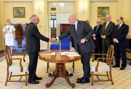 Commissioner Justice Peter McClellan and the Governor-General of Australia Peter Cosgrove at the signing ceremony and the release of the final report of the Royal Commission into Institutional Responses to Child Sexual Abuse in Canberra, Australia, December 15, 2017. Royal Commission into Institutional Responses to Child Sexual Abuse/Handout via REUTERS