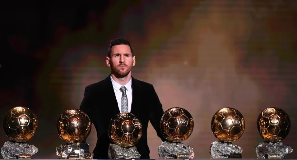 TOPSHOT - Barcelona&#39;s Argentinian forward Lionel Messi reacts after winning the Ballon d&#39;Or France Football 2019 trophy at the Chatelet Theatre in Paris on December 2, 2019. - Lionel Messi won a record-breaking sixth Ballon d&#39;Or on Monday after another sublime year for the Argentinian, whose familiar brilliance remained undimmed even through difficult times for club and country. (Photo by FRANCK FIFE / AFP) (Photo by FRANCK FIFE/AFP via Getty Images)